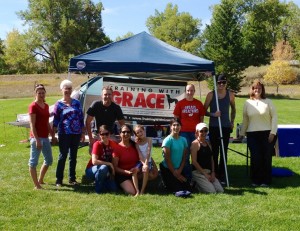 Training With Grace staff and the current class of dog-trainer apprentices.  The students got some field experience -- literally -- at a recent expo, where Training With Grace also led agility demonstrations.